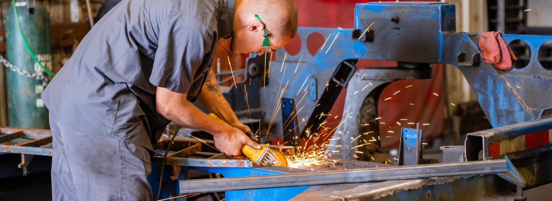 A man working while sparks flying